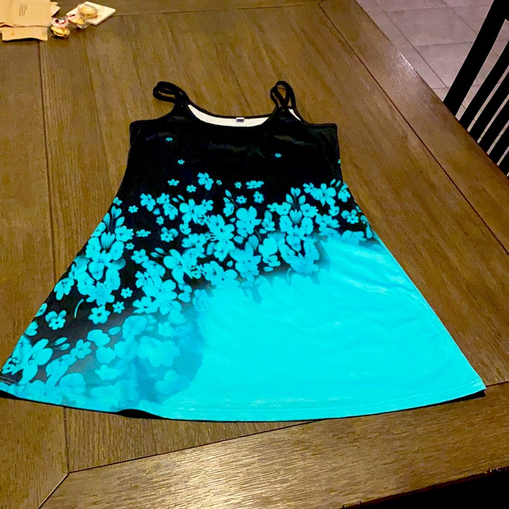 Stylish print sleeveless mini. Tropical flower print in a vibrant blue